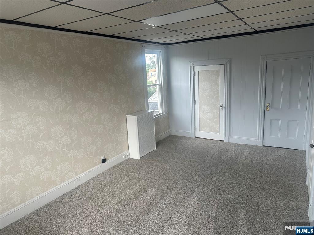 217 Boulevard, Unit 2B Hasbrouck Heights, NJ 07604 - Photo 8 of 11 a view of an empty room with a fireplace