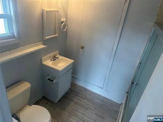 a kitchen with stainless steel appliances a stove a sink and a refrigerator