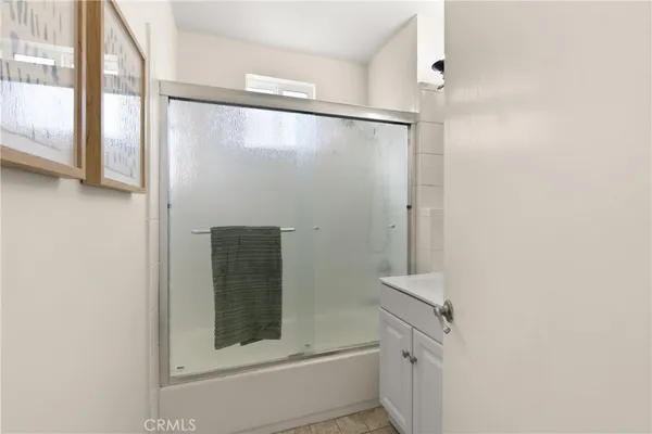 a view of a backyard with plants and patio