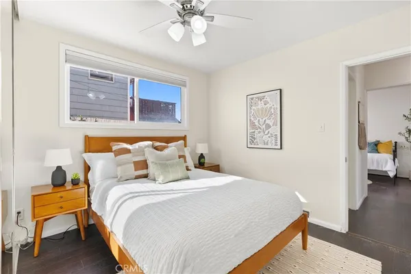 a view of a patio with table and chairs potted plants with wooden floor