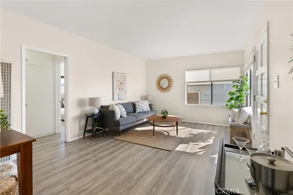 a front view of a house with glass windows and table