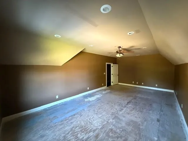 an empty room with a empty space and windows