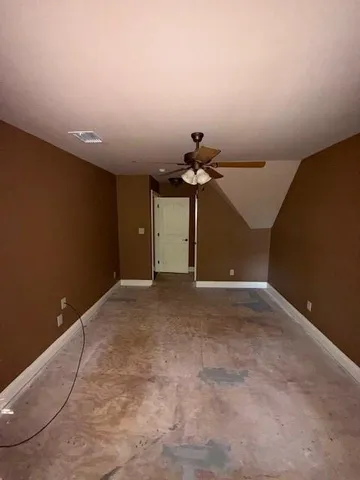 a view of a room with a hanging light