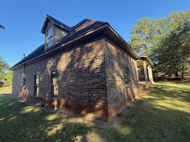 a backyard of a house with lots of green space