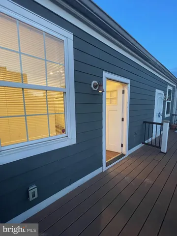 a view of front door and wooden floor