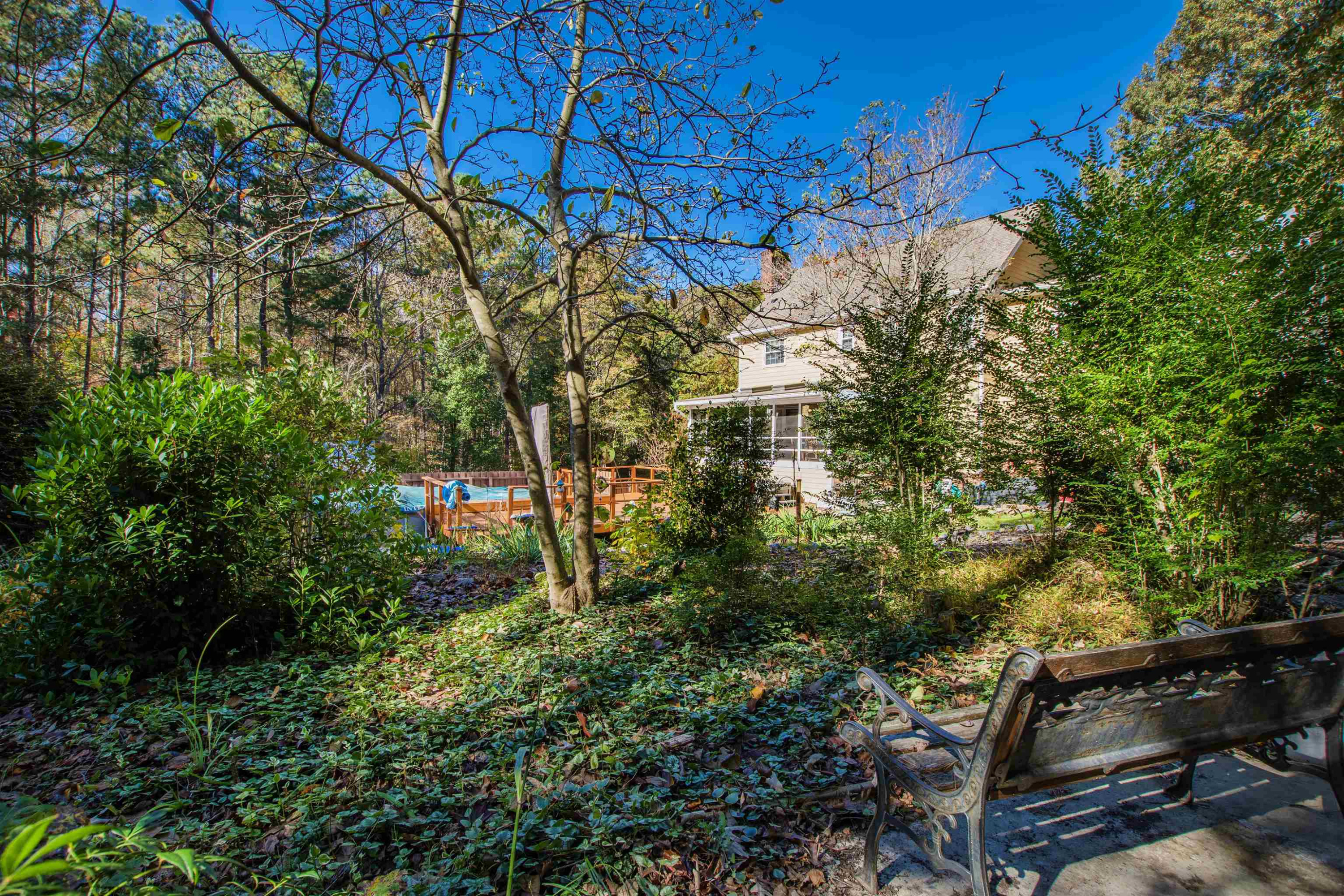 6404 Olivula Terrace Raleigh, NC 27613 - Photo 46 of 49 a backyard of a house with lots of green space