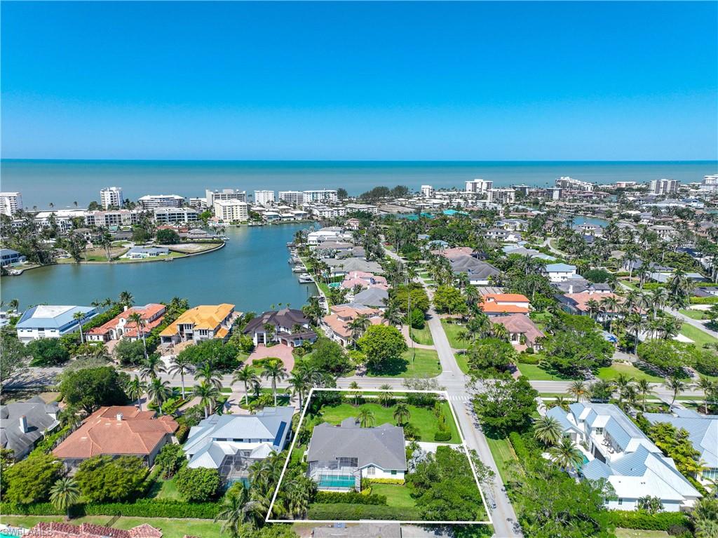 1850 Crayton Road Naples, FL 34102 - Photo 2 of 48 an aerial view of ocean and residential houses with outdoor space