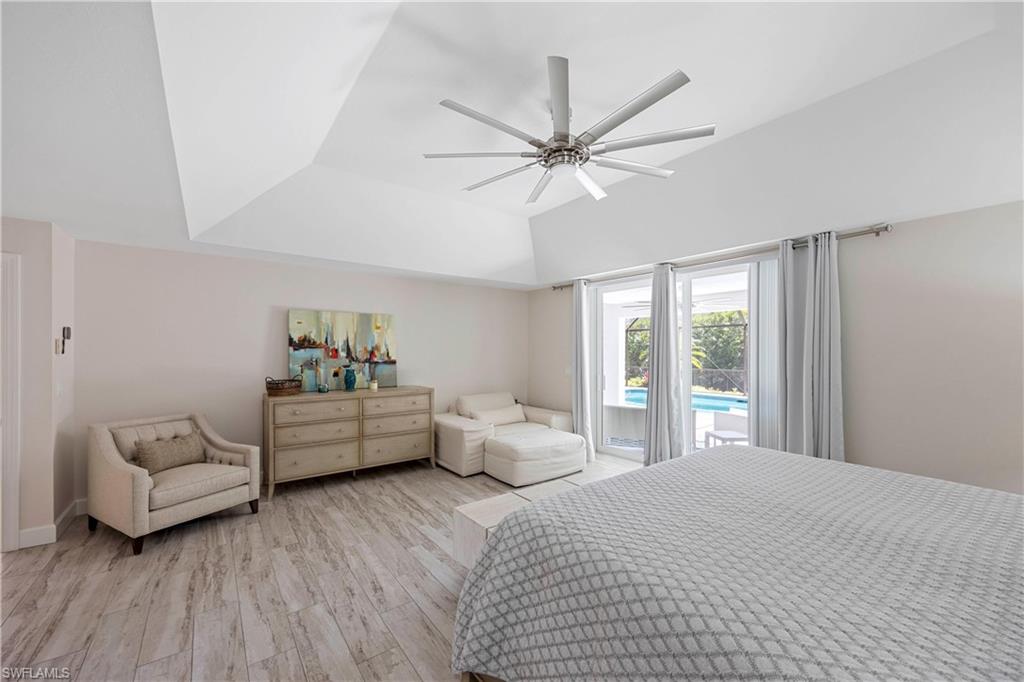 1850 Crayton Road Naples, FL 34102 - Photo 22 of 48 a bedroom with furniture and windows