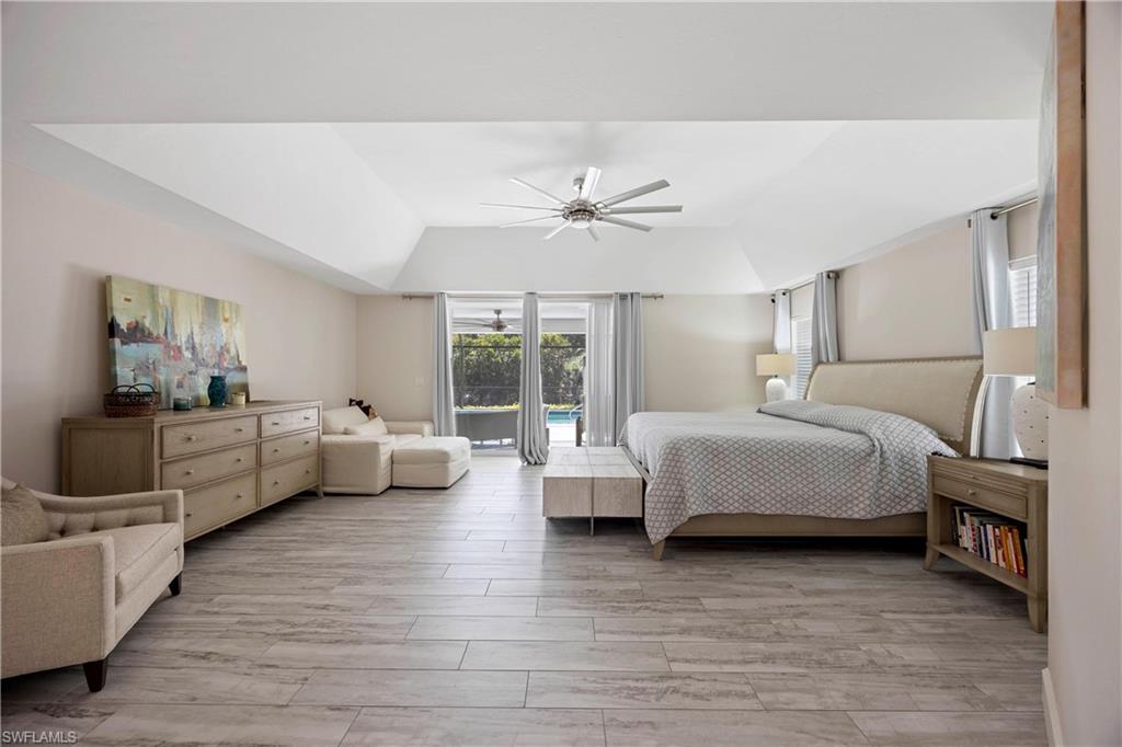 1850 Crayton Road Naples, FL 34102 - Photo 26 of 48 a bedroom with furniture and a large window