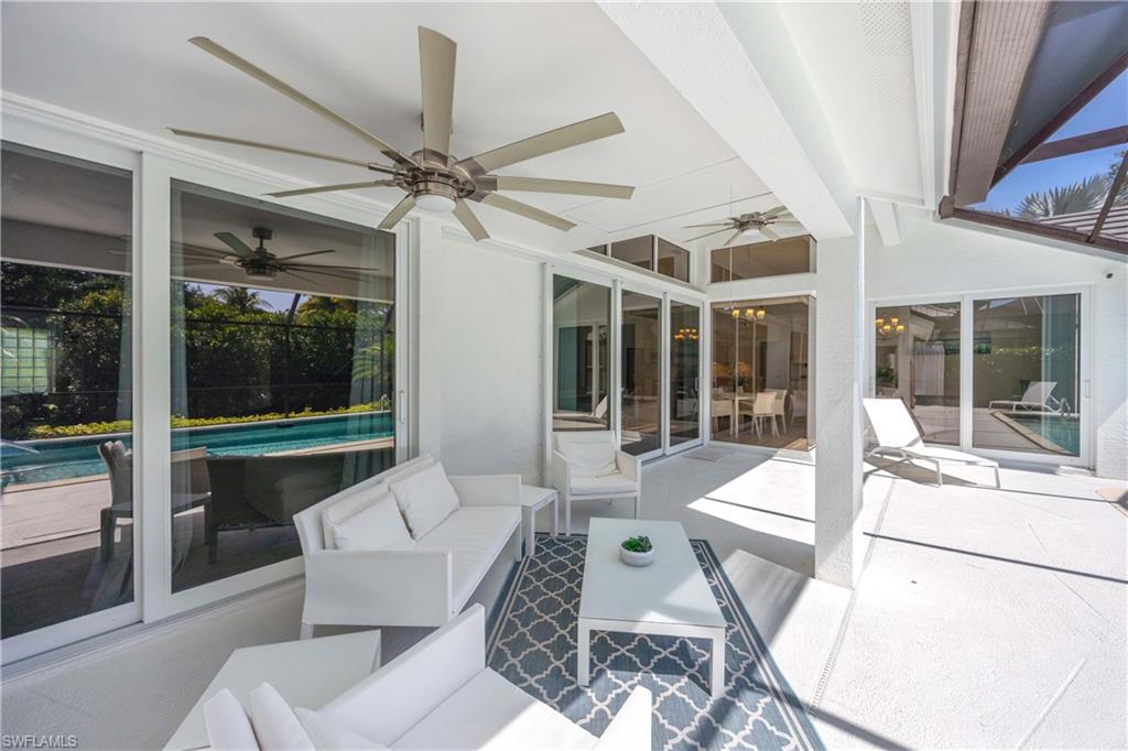 1850 Crayton Road Naples, FL 34102 - Photo 35 of 48 a living room with furniture and a large window