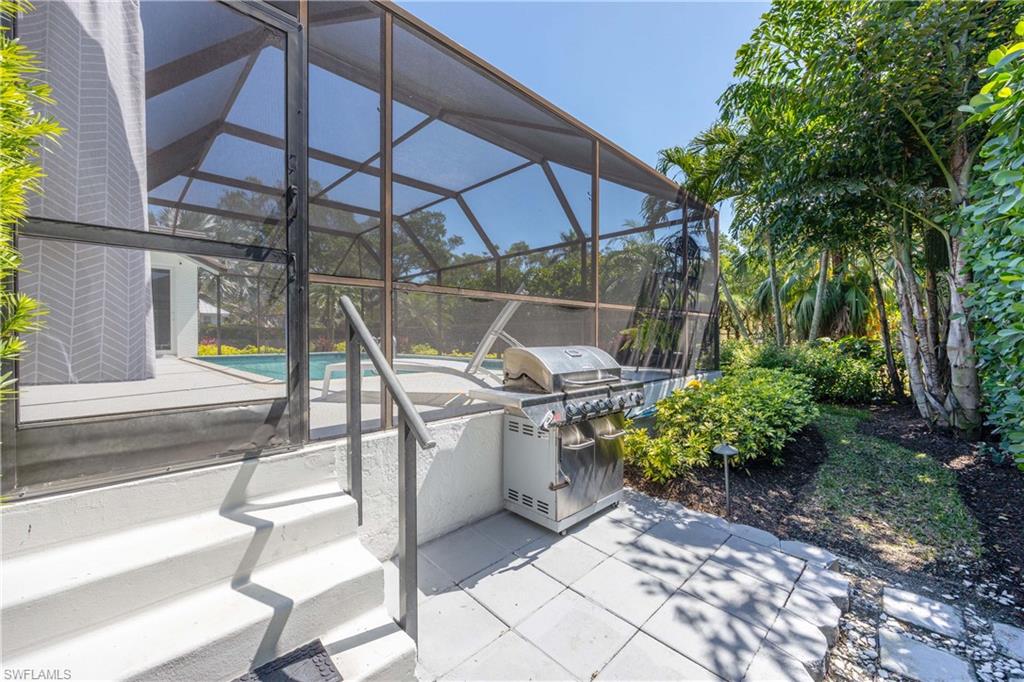 1850 Crayton Road Naples, FL 34102 - Photo 45 of 48 a view of a chairs and table in the patio