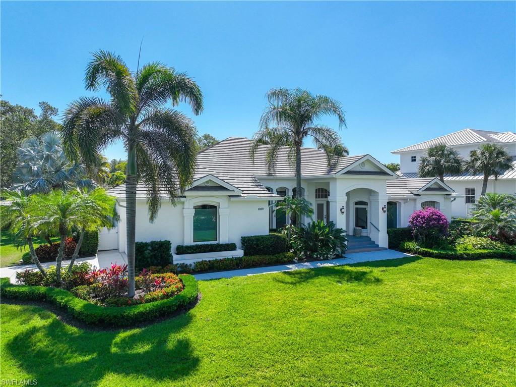 1850 Crayton Road Naples, FL 34102 - Photo 5 of 48 a front view of house with yard and green space