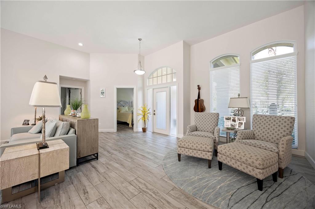 1850 Crayton Road Naples, FL 34102 - Photo 9 of 48 a living room with furniture and a large window