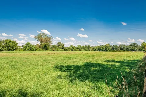 a view of a lake with a big yard