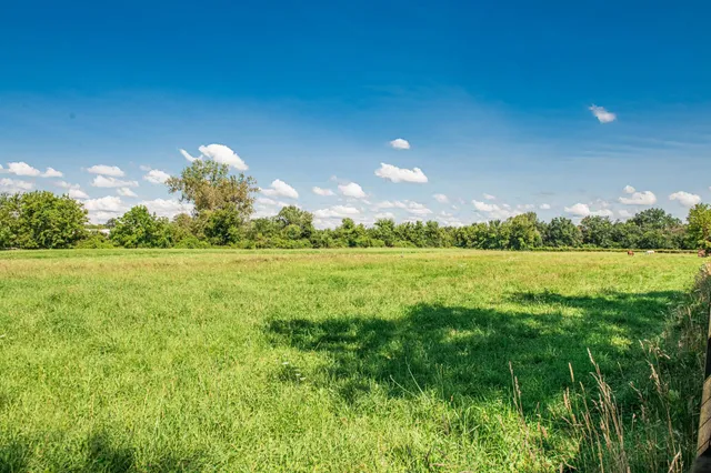 a view of a lake with a big yard