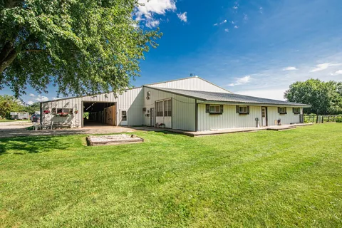 a view of a house with a backyard