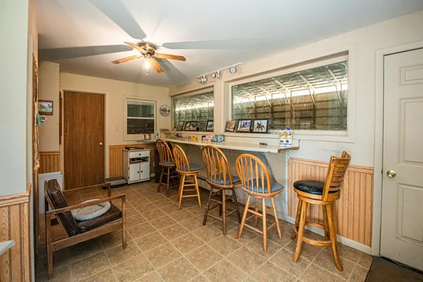 a view of a dining room with furniture window and outside view