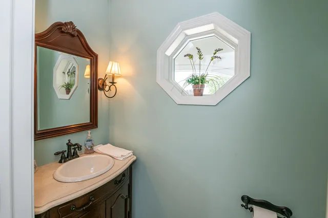 a bathroom with a sink and a mirror