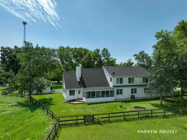 a aerial view of a house with a big yard