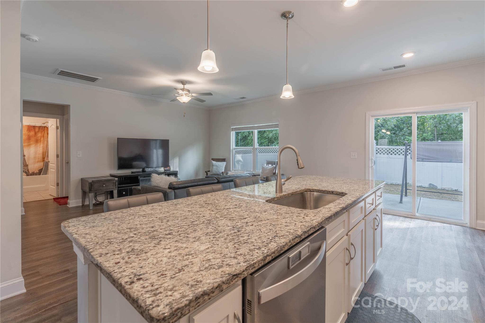 1163 Pecan Ridge Road Fort Mill, SC 29715 - Photo 7 of 34 a kitchen with granite countertop a sink a counter top space and stainless steel appliances