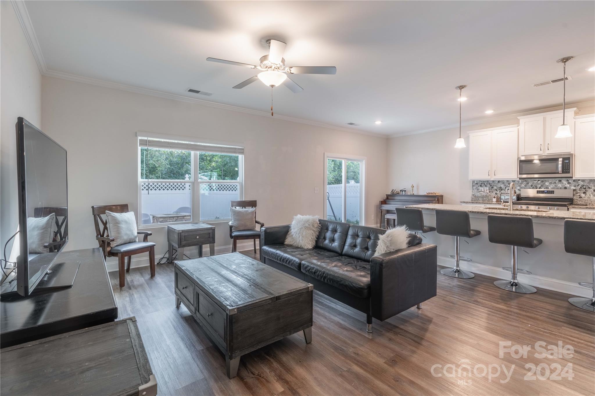 1163 Pecan Ridge Road Fort Mill, SC 29715 - Photo 10 of 34 a living room with furniture kitchen area and a window