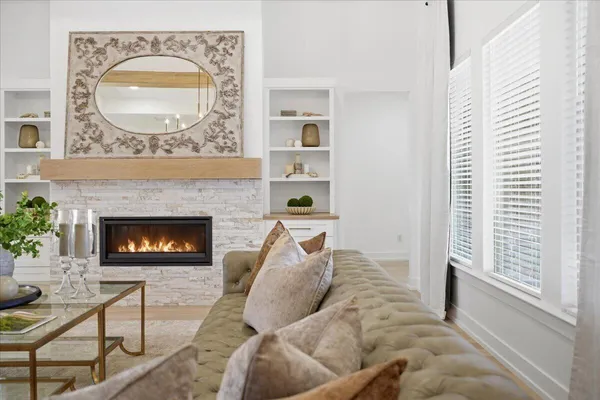a living room with furniture and a fireplace