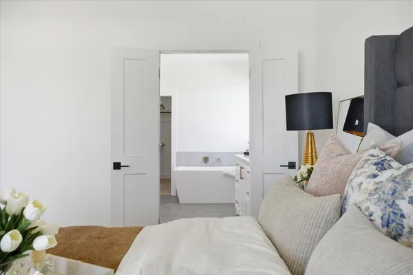 a bathroom with a glass shower door