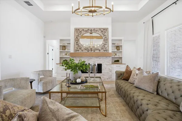 a living room with furniture and a fireplace