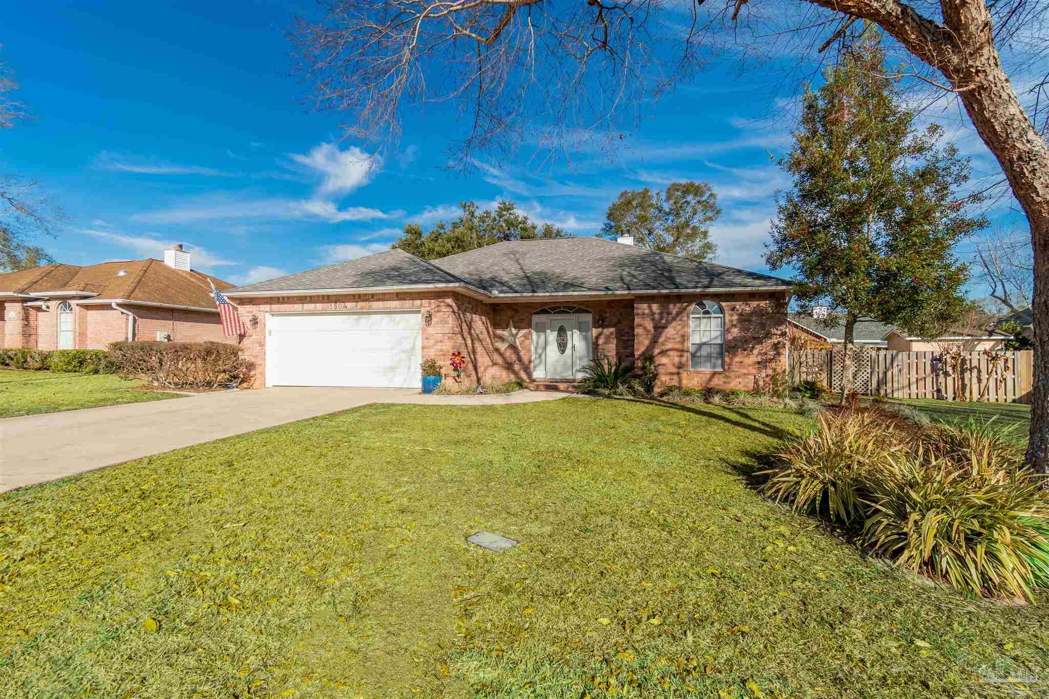 1504 Muirfield Road Cantonment, FL 32533 - Photo 1 of 17 a view of a house with a yard