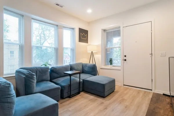a living room with furniture and a window