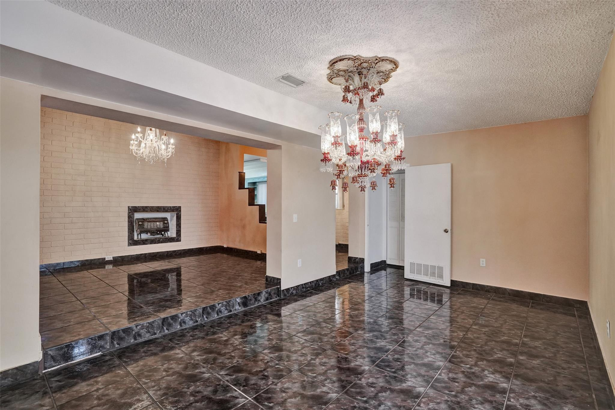 225 Pocatella Street Miami Springs, FL 33166 - Photo 18 of 56 a view of a livingroom with a chandelier