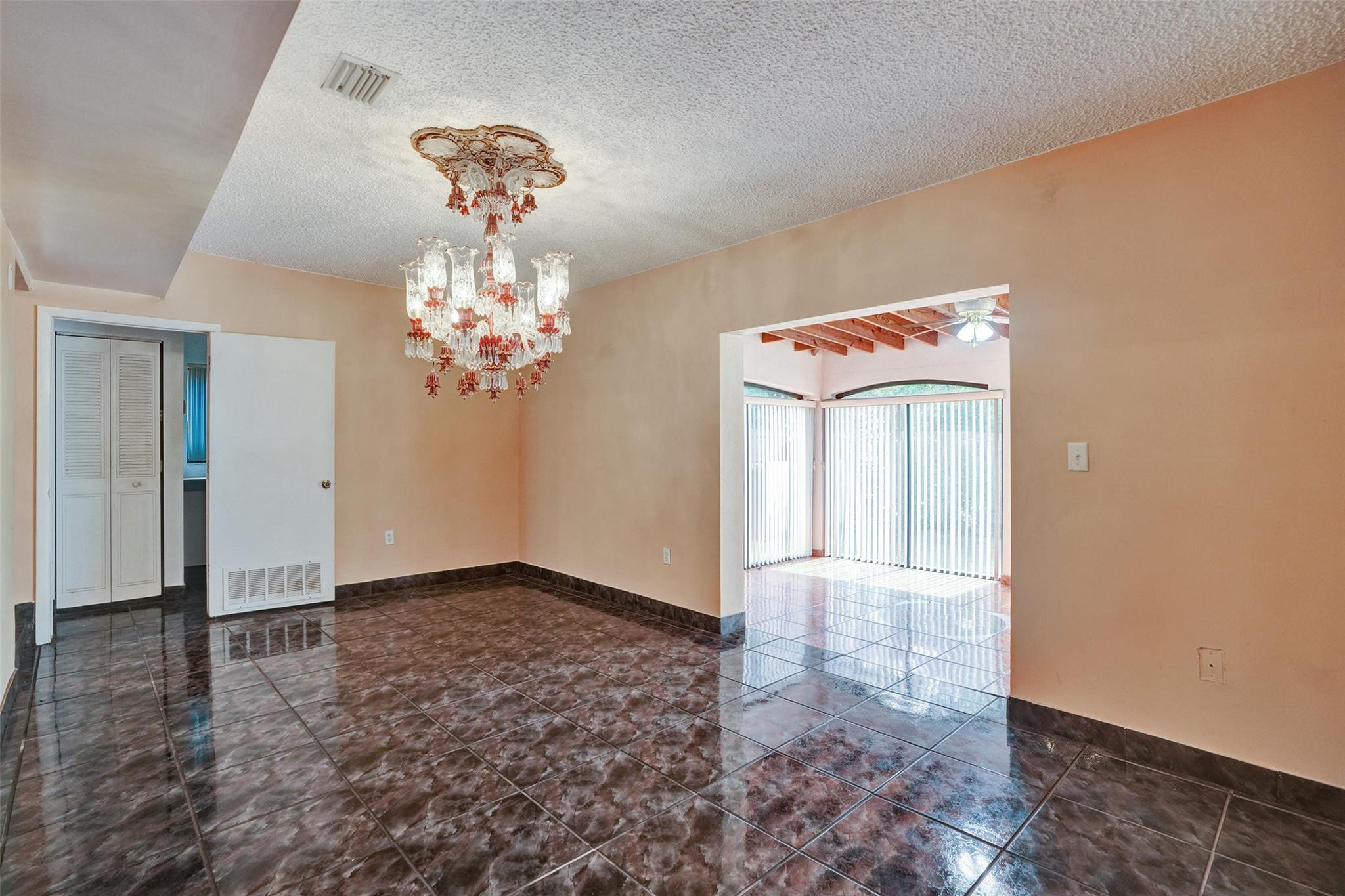 225 Pocatella Street Miami Springs, FL 33166 - Photo 19 of 56 a view of a chandelier in big room