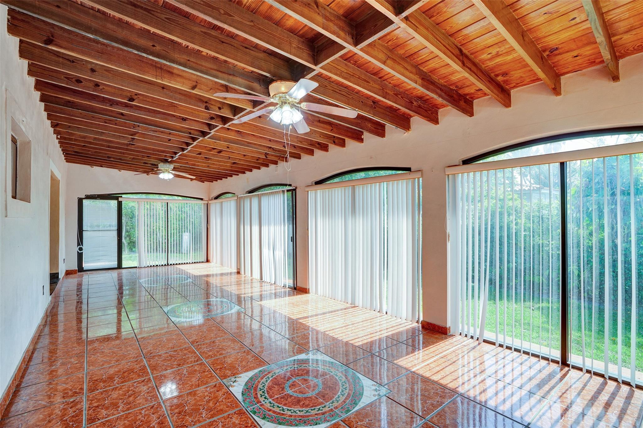 225 Pocatella Street Miami Springs, FL 33166 - Photo 23 of 56 a outdoor space with lots of windows