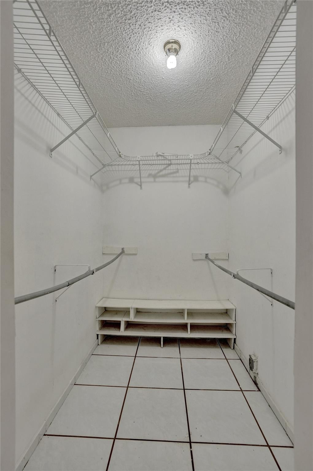 225 Pocatella Street Miami Springs, FL 33166 - Photo 34 of 56 a view of room with racks on the wall