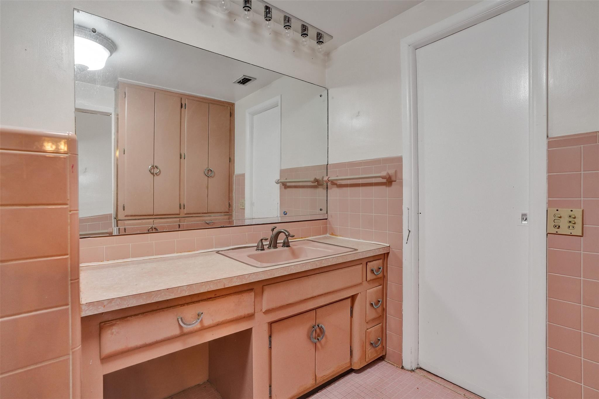 225 Pocatella Street Miami Springs, FL 33166 - Photo 38 of 56 a bathroom with a sink and a mirror
