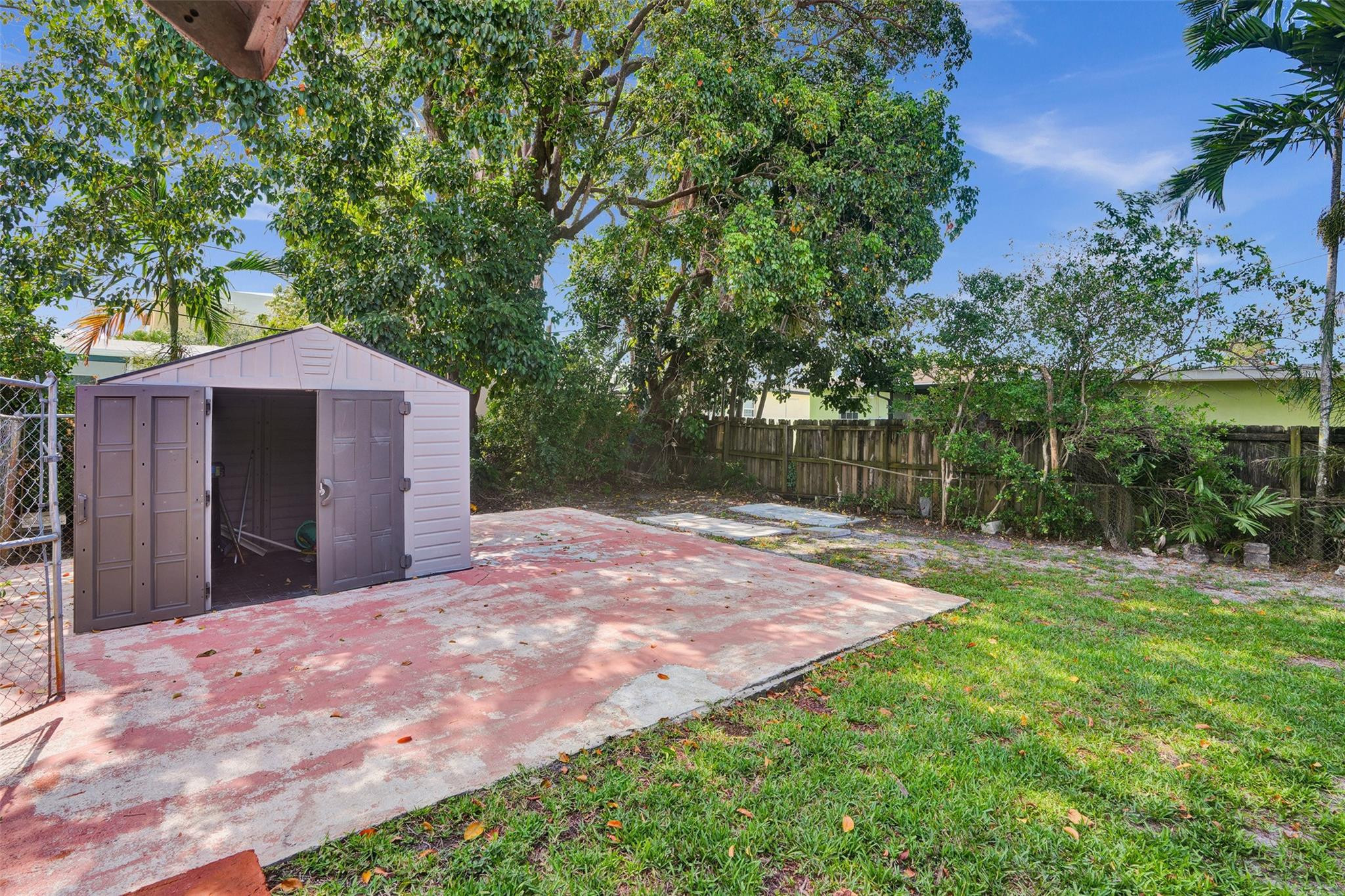 225 Pocatella Street Miami Springs, FL 33166 - Photo 43 of 56 a backyard of a house with lots of green space