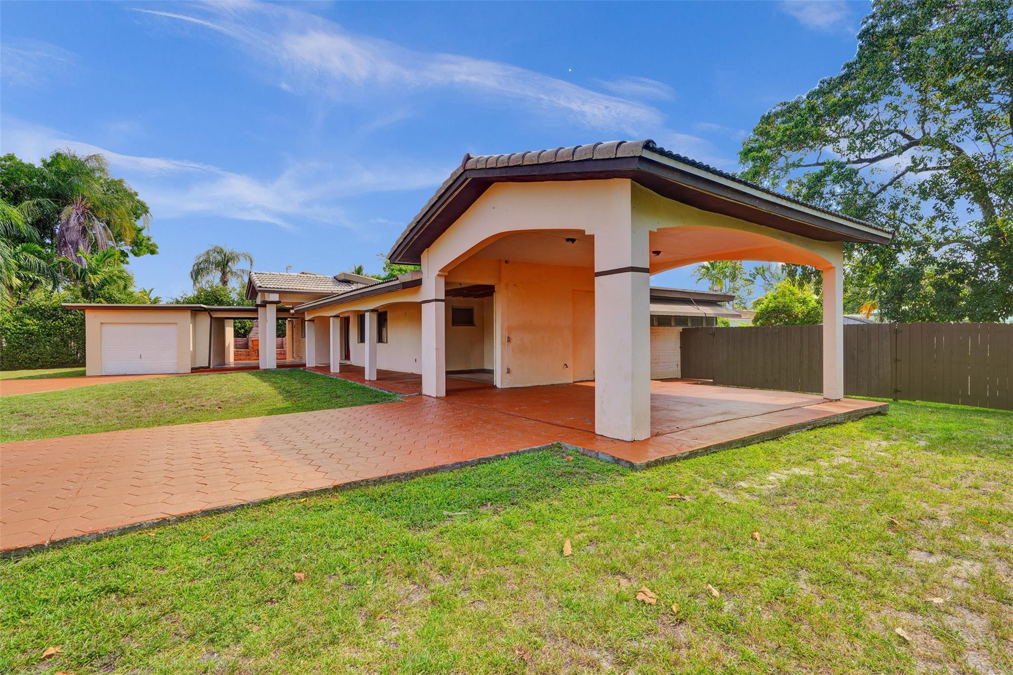 225 Pocatella Street Miami Springs, FL 33166 - Photo 45 of 56 a front view of a house with a yard and garage