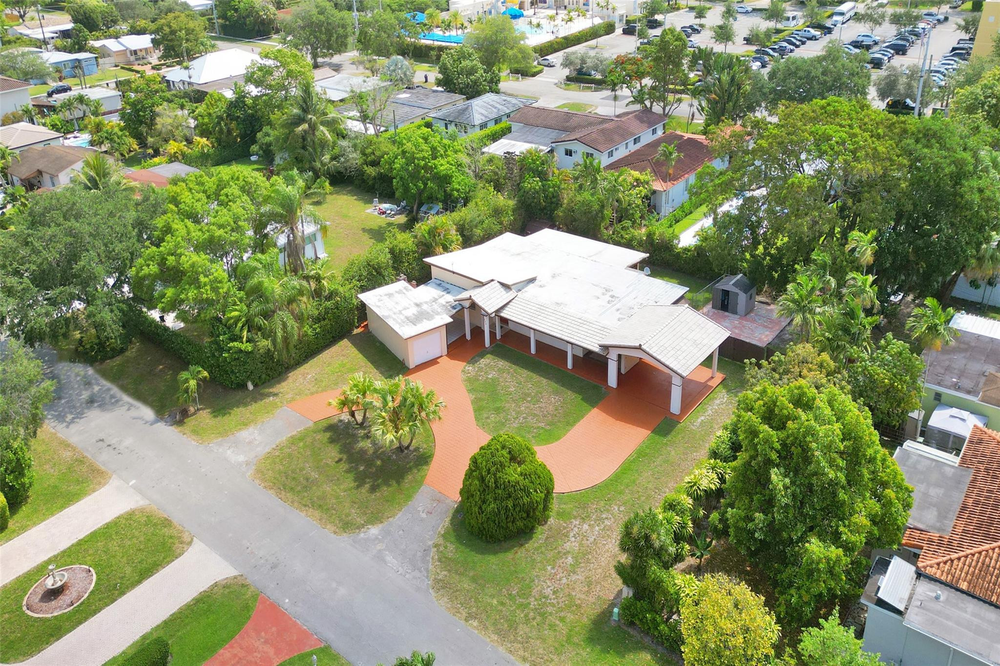 225 Pocatella Street Miami Springs, FL 33166 - Photo 49 of 56 an aerial view of a house with garden space and street view