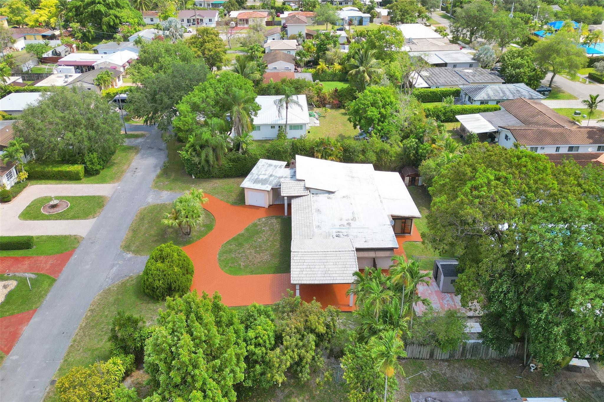 225 Pocatella Street Miami Springs, FL 33166 - Photo 50 of 56 an aerial view of a house with swimming pool and garden