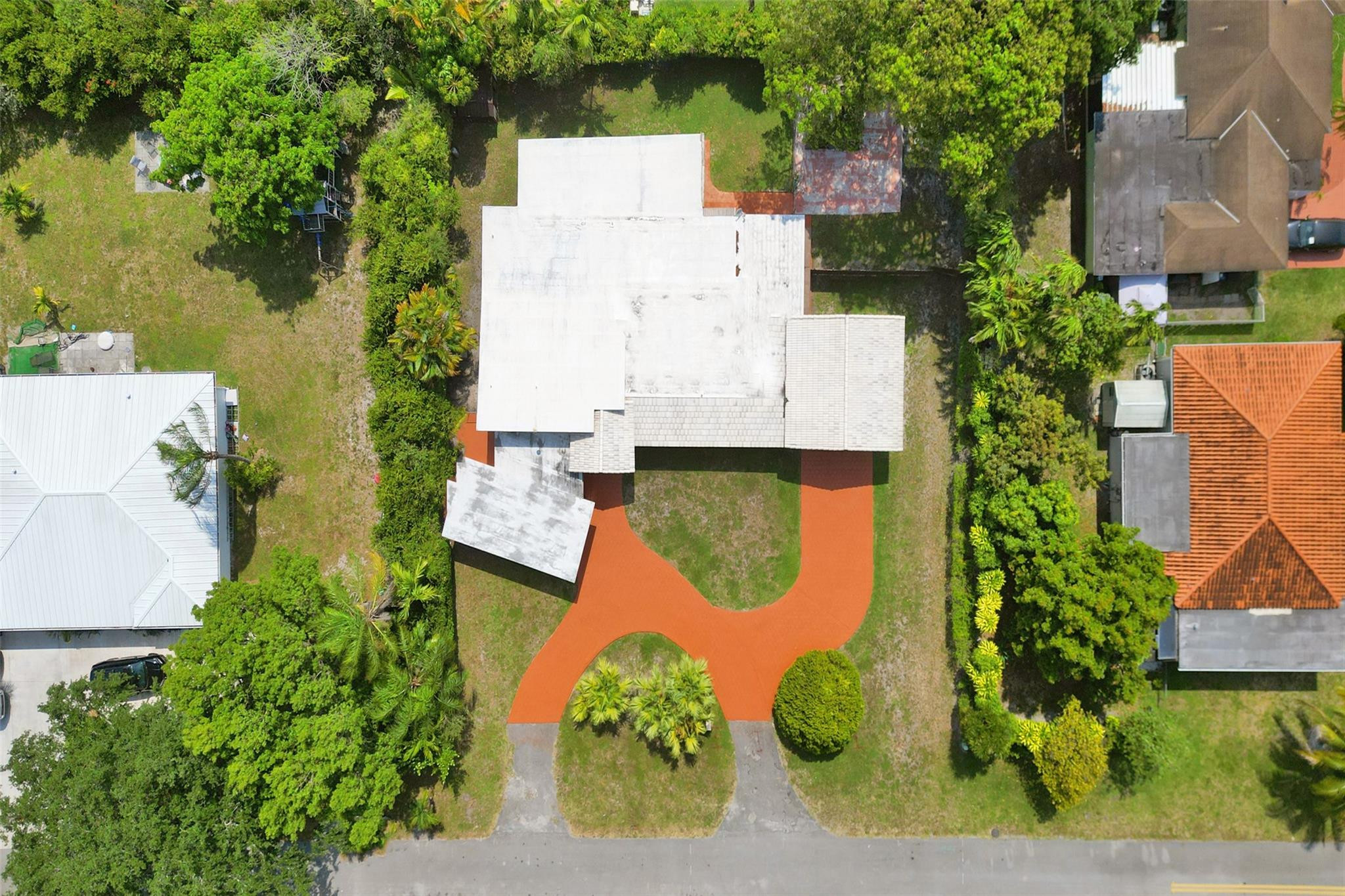 225 Pocatella Street Miami Springs, FL 33166 - Photo 53 of 56 an aerial view of a house with a garden and large trees