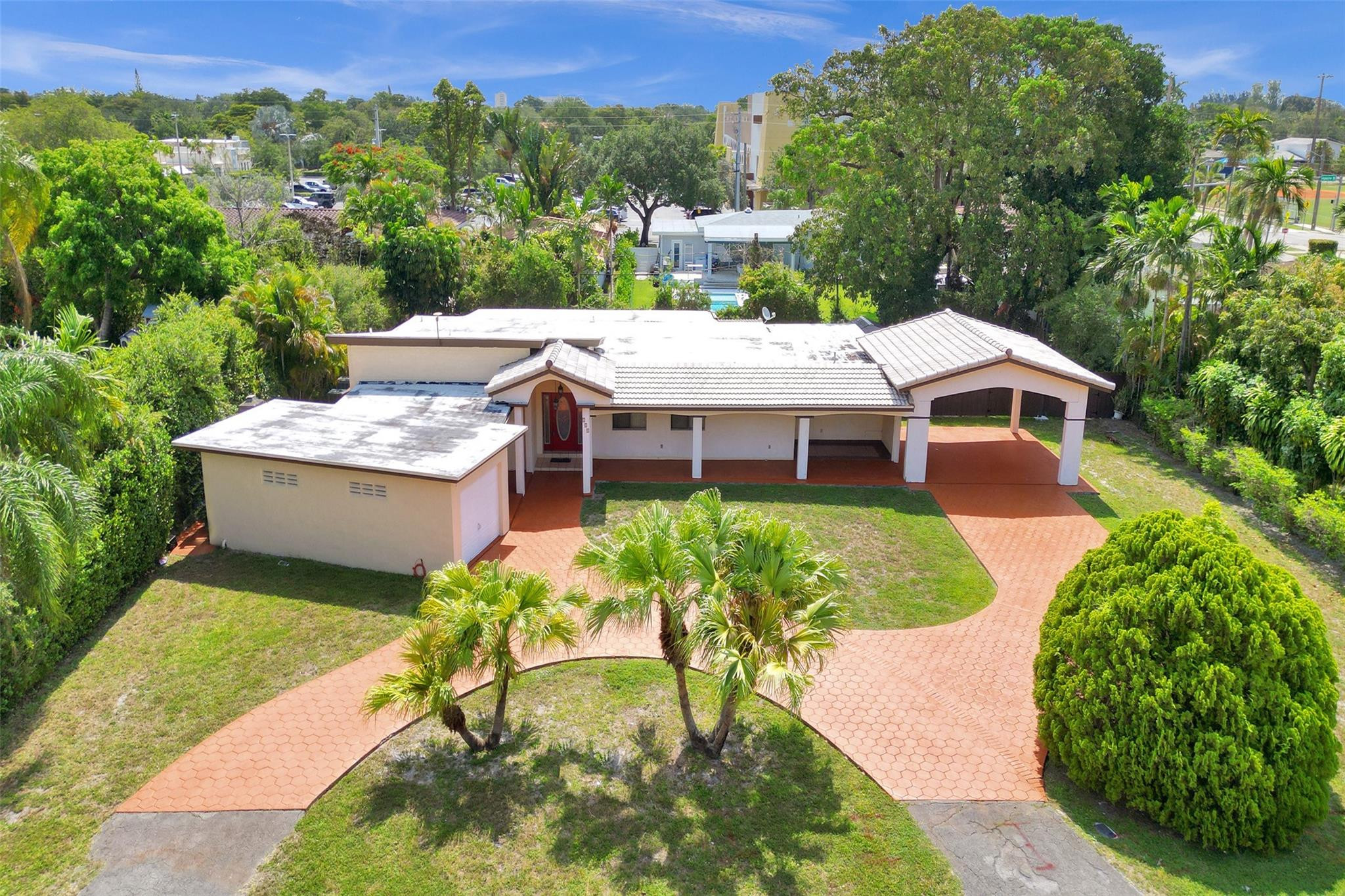 225 Pocatella Street Miami Springs, FL 33166 - Photo 55 of 56 a aerial view of a house with a yard and potted plants
