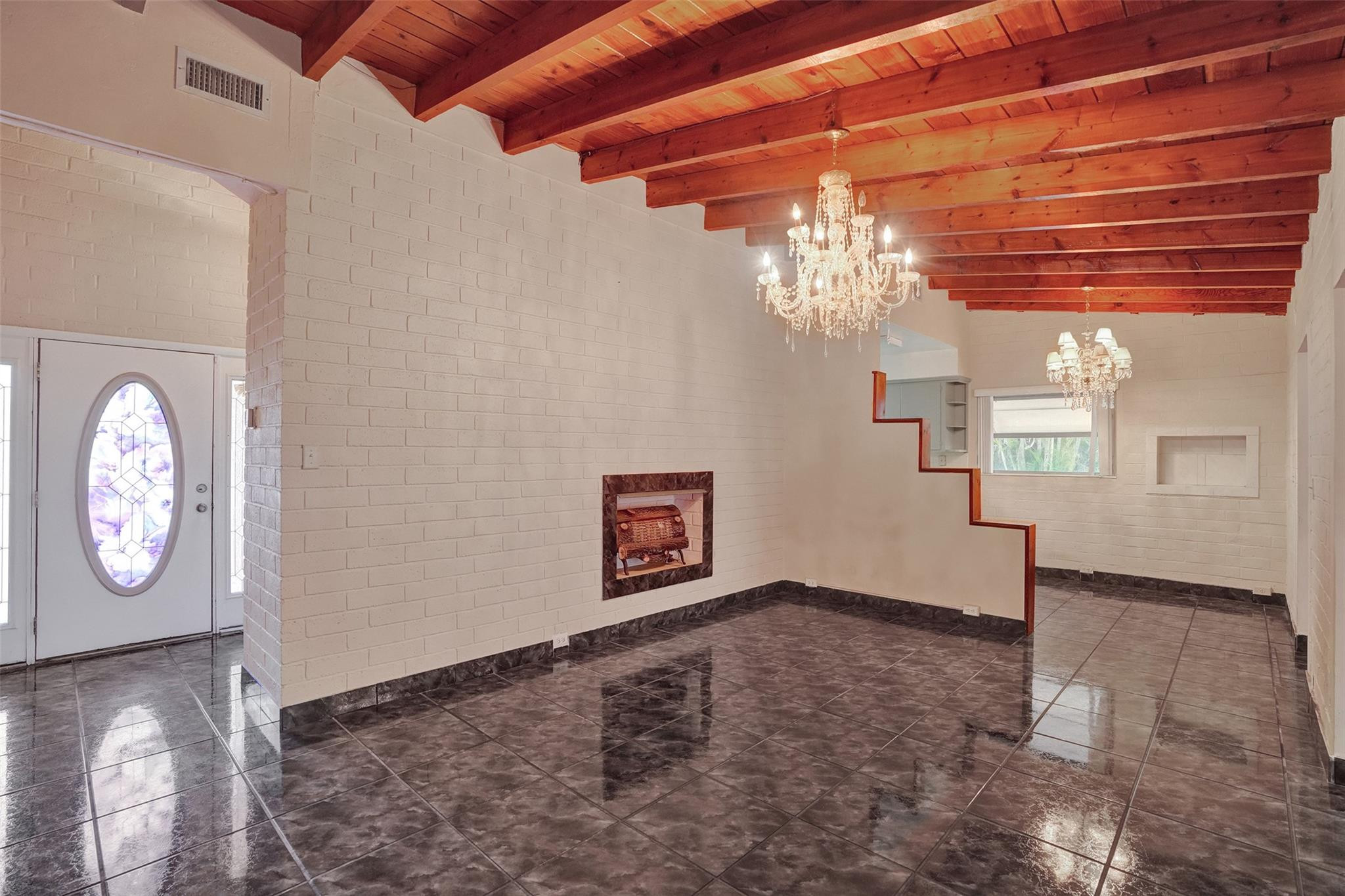 225 Pocatella Street Miami Springs, FL 33166 - Photo 6 of 56 a view of a livingroom with wooden floor and a large window