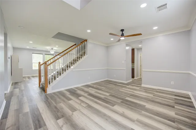 a view of an entryway with wooden floor