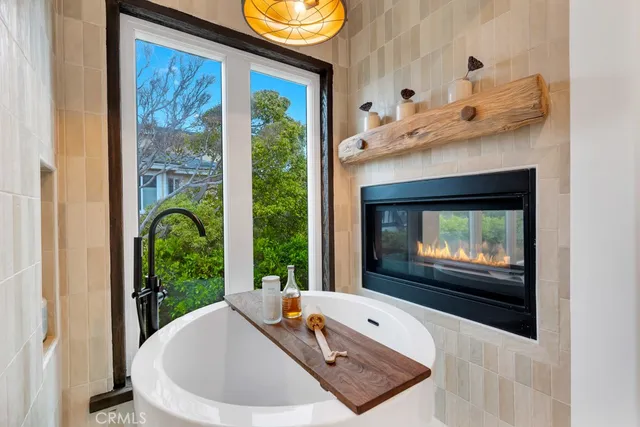 a hallway with a sink and a mirror