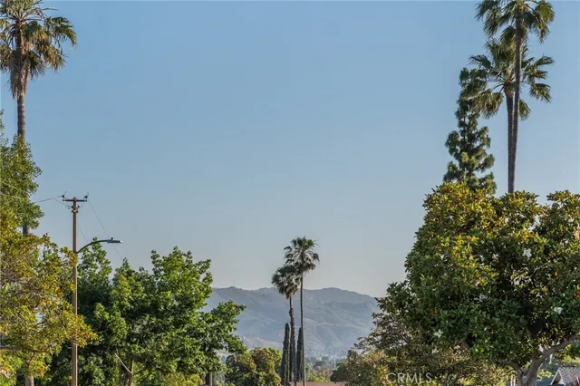 a kitchen with stainless steel appliances granite countertop a sink and a stove