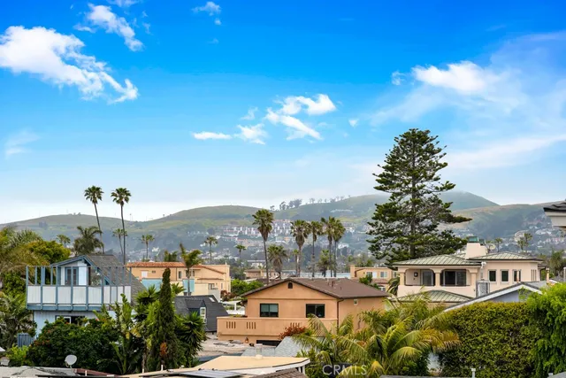 a kitchen with stainless steel appliances kitchen island granite countertop a refrigerator and a sink