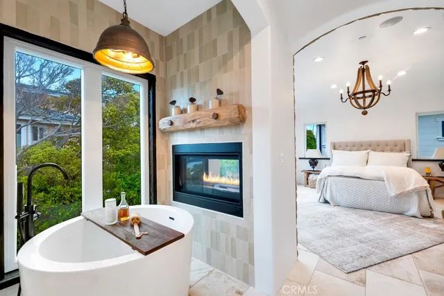 a bedroom with a large bed and a large window