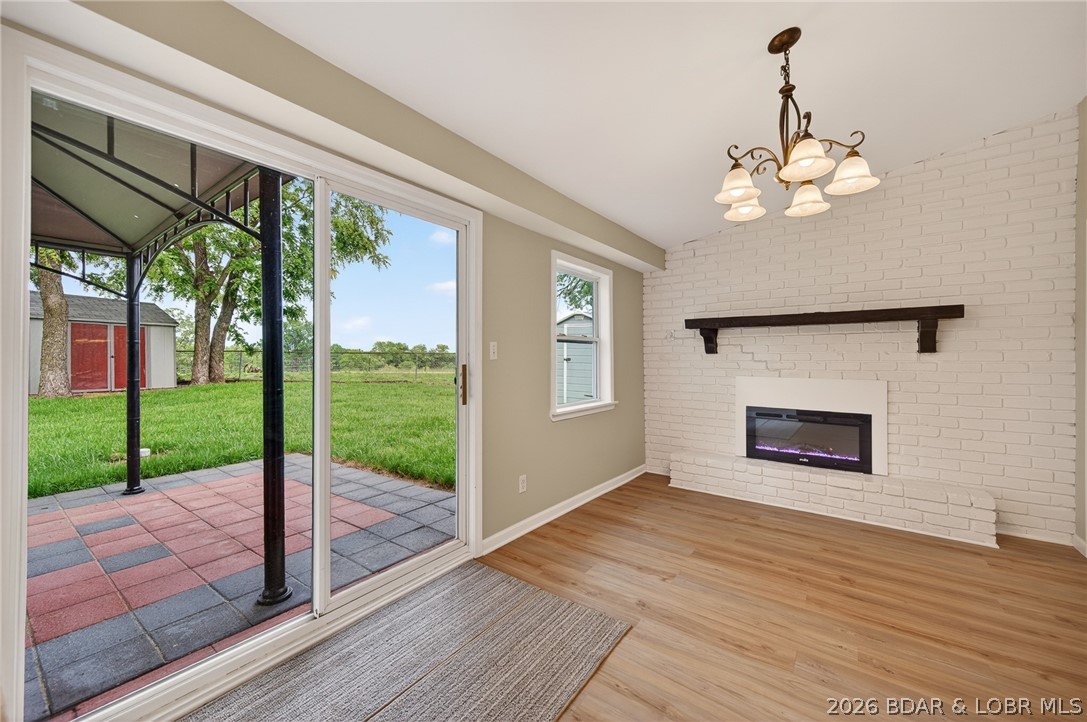 177 Storage Road Eldon, MO 65026 - Photo 11 of 34 A chic white-brick accent wall houses a contempora
