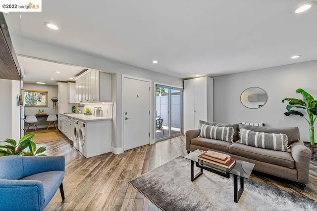 a living room with furniture and a rug