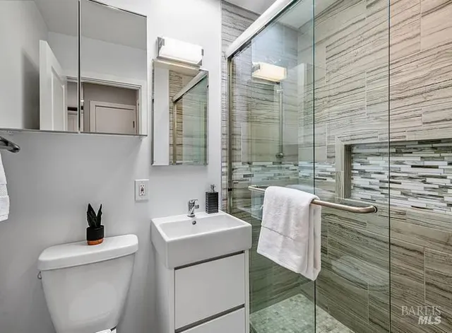 a bathroom with a sink and mirror